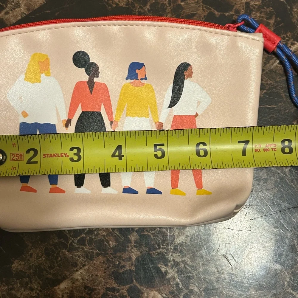 Ipsy tan make up bag featuring diverse groups of women